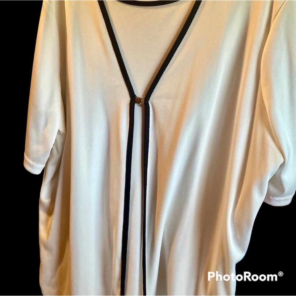 White with black trim blouse.